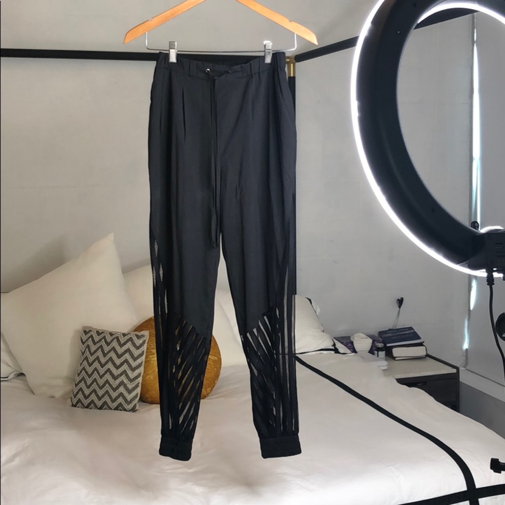 Harem pants with mesh inserts